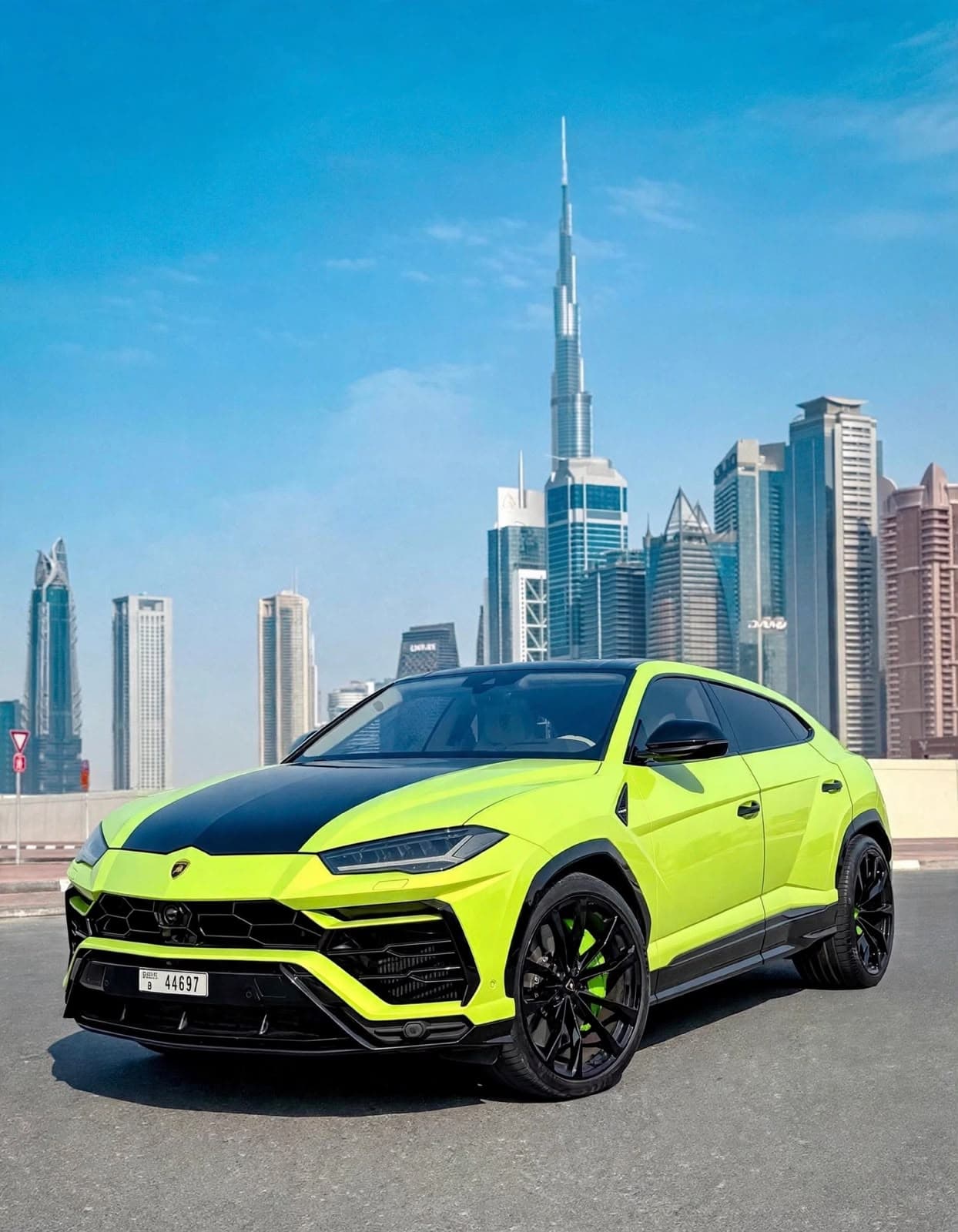 Lamborghini Urus (Green), front view with the Dubai skyline